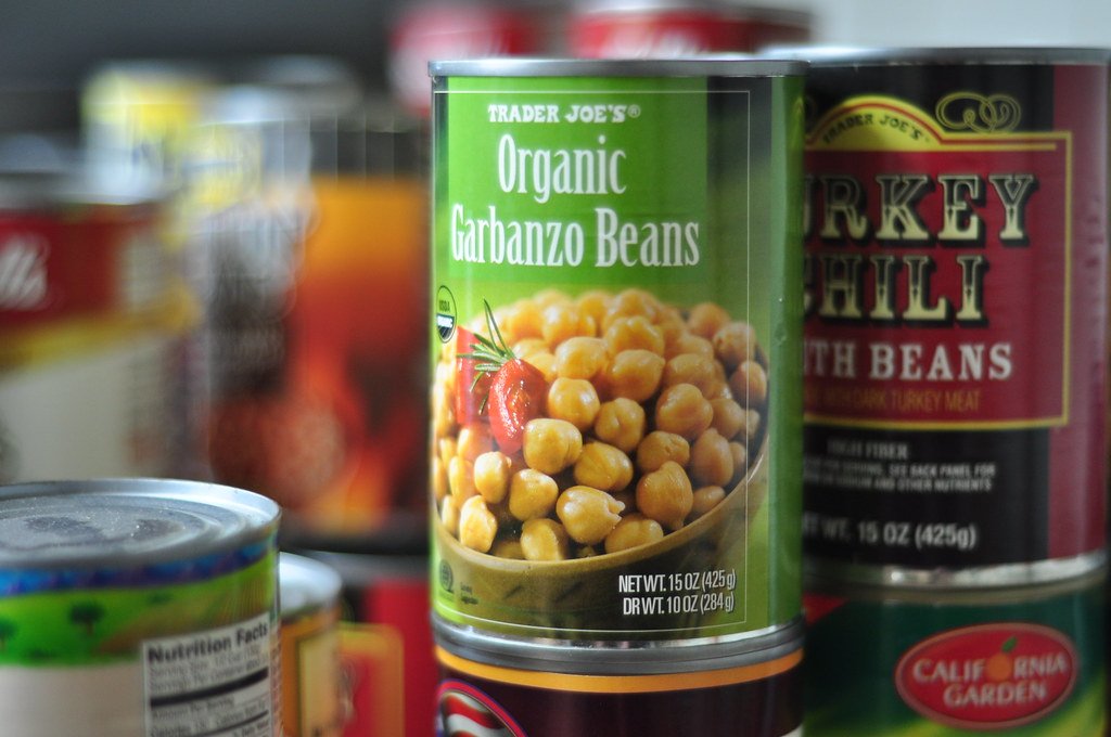 Can of Garbanzo beans in a well-stocked pantry